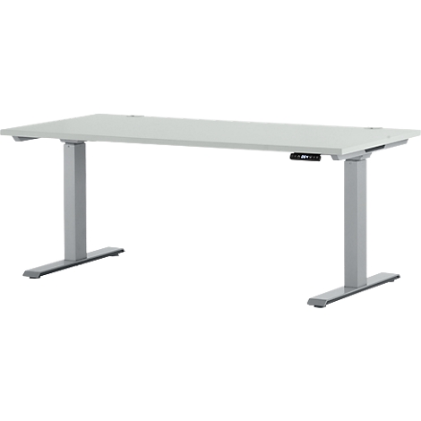 Een witte, in hoogte verstelbare bureau met grijze poten staat op een witte achtergrond. Een bedieningspaneel is op de tafel gemonteerd.