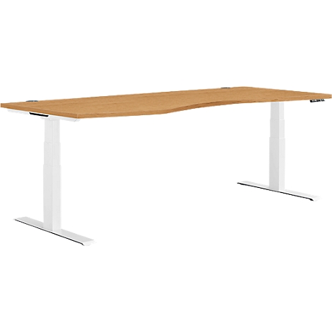 Bureau ergonomique brun clair avec pieds blancs réglables en hauteur. Le plateau de la table a une forme incurvée.