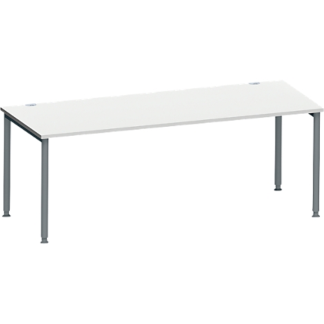 Bureau blanc avec pieds gris. Deux ouvertures rondes dans la surface.