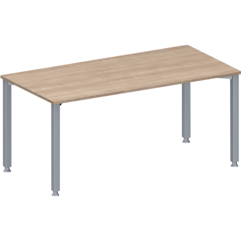 A rectangular table with a light brown wooden top and gray metal legs.