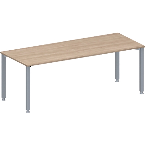 Rectangular table with beige wooden top and silver legs.