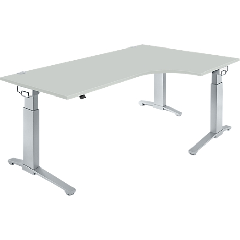 Gray, height-adjustable corner desk, with metal legs on the left and right.