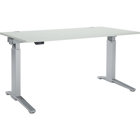 A height-adjustable desk with a white tabletop and gray legs. A control console is on the right side.