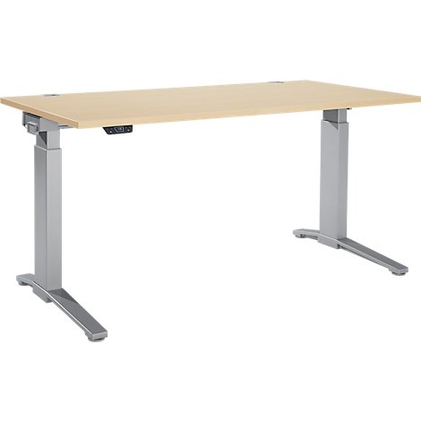 Light brown rectangular standing desk with gray metal legs. Control elements are visible on the tabletop.