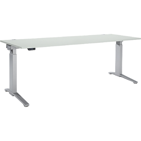 A white, height-adjustable desk on silver legs. It has a control element.