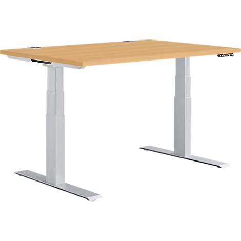 A height-adjustable desk with a light brown tabletop and silver legs.