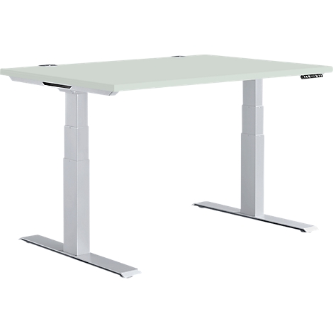 An adjustable height desk against a white backdrop. The tabletop is light gray, and the legs and frame are silver.