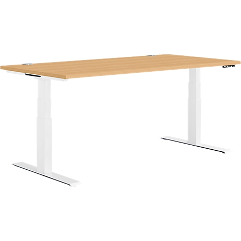 Beige wooden desk with a white base. It is height adjustable.