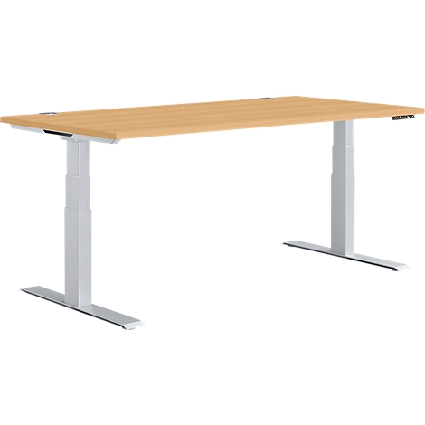 Light brown, height-adjustable desk with grey legs and controls on the right.