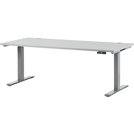Light gray height-adjustable desk. It has two legs attached at the ends. The desk is on a white background.