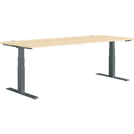 Light brown adjustable desk, grey legs, light brown tabletop.