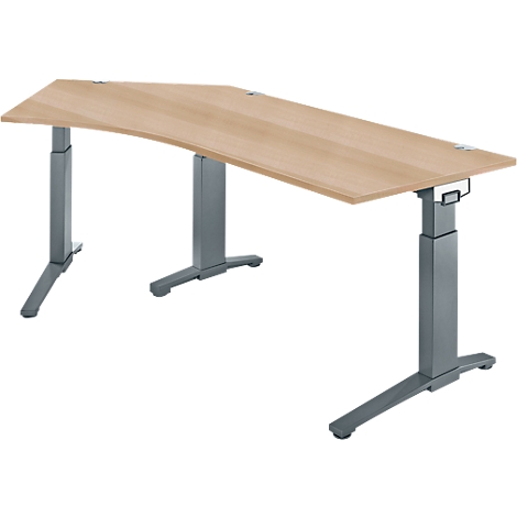 A light brown height-adjustable desk with gray legs stands against a white background.