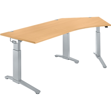 Light brown ergonomic desk with curved tabletop and height-adjustable, silver-colored legs.
