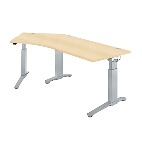 An ergonomic, height-adjustable desk with a light brown table top and silver legs.