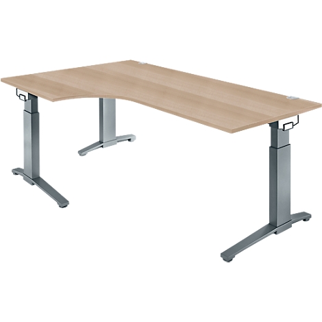 An adjustable corner desk made of wood with gray metal legs, against a white background.