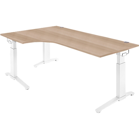 A corner desk with height-adjustable white legs and a light brown tabletop.