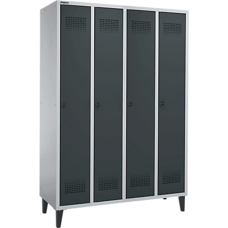 A gray locker with four doors, square vents, and black handles. The cabinet stands on black legs.