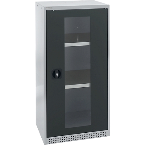 A metal cabinet with glass door, several shelves inside. A black handle on the door.