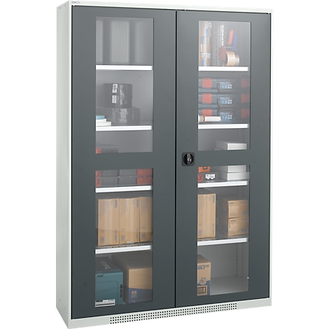 Gray cabinet with glass doors. Inside, shelves are filled with various objects including boxes, tools, and rolls.