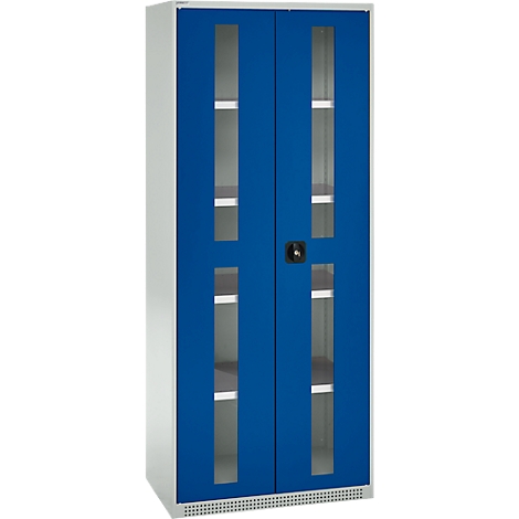 Blue cabinet with glass windows. A cabinet with two doors, each with two glass windows. There is a handle in the middle.