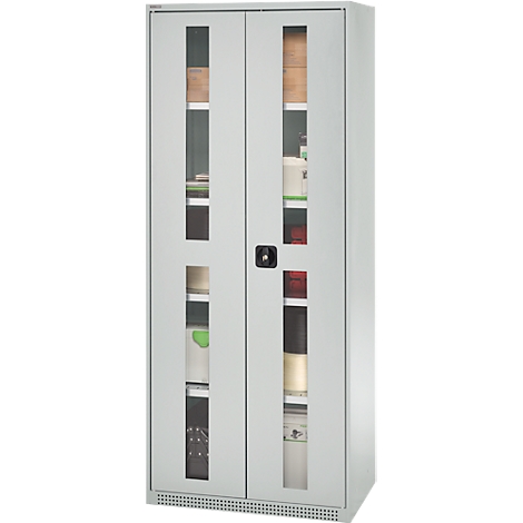 Grey cabinet with glass windows. Divided into different compartments, filled with folders, boxes and other items.