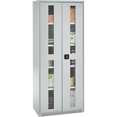 Grey steel cabinet with glass windows, filled with folders and office supplies. A dark handle is in the middle.