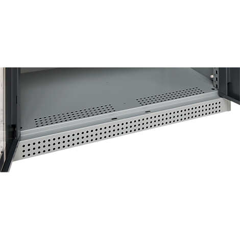 Close-up of a gray metal shelf with a perforated pattern. The shelf is integrated into a cabinet, the door is open.