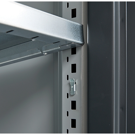 Close-up of a metal shelf. The silver shelves are attached to a gray vertical metal post with a bracket.