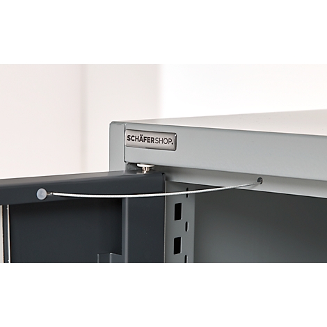 Detailed view of a gray cabinet, the door is open. The SCHÄFERSHOP logo can be seen in the picture.