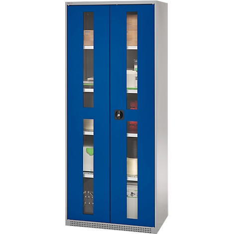 Blue cabinet with glass doors, filled with objects, black handle.