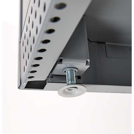 Close-up of an adjustable screw attached to a metal frame. The metal has holes, and the screw has a flat base.
