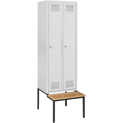White locker with two doors, above a wooden bench. The locker has ventilation slots and small knobs.