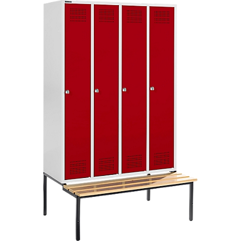 Locker with four red doors, white frame, and a bench.