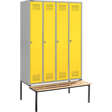 Yellow locker with four compartments, grey side panels, with a wooden bench in front. Perfect for changing rooms.