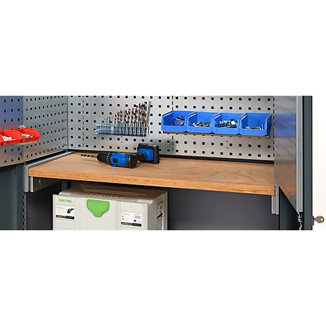 Workbench with tools: drill bits, blue storage bins with screws, wooden shelf, cordless drill.