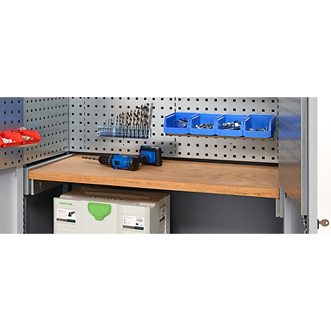 Tool cabinet with accessories. Drills, screws, a drill, tool boxes and shelves.