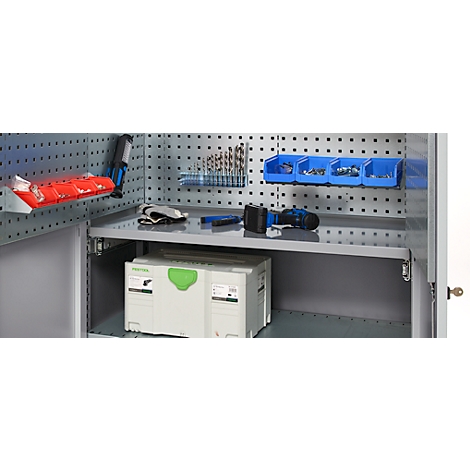 Tool cabinet with tools like drills, screws, and cordless screwdriver, a toolbox is in the cabinet.
