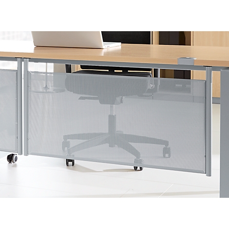 Grey office desk, partially hidden by a metal mesh screen, wheelchair in front.