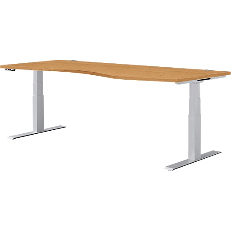 Hellbrauner, ergonomischer Schreibtisch mit hellgrauen, höhenverstellbaren Beinen auf weissem Hintergrund.