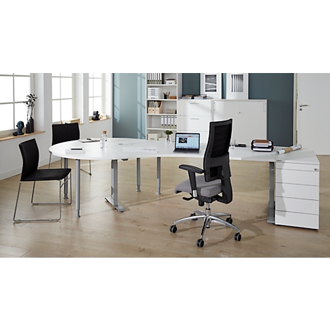 Office with modern desk and ergonomic chair. A laptop is on the desk. In the background, a window and cabinets.
