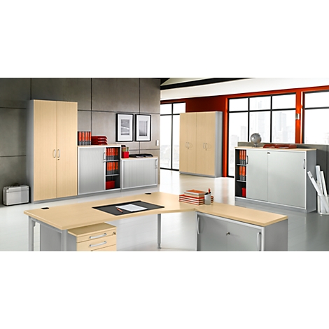 Office with wooden cabinets, desk, and office furniture. Windows overlooking the outside, bright atmosphere.