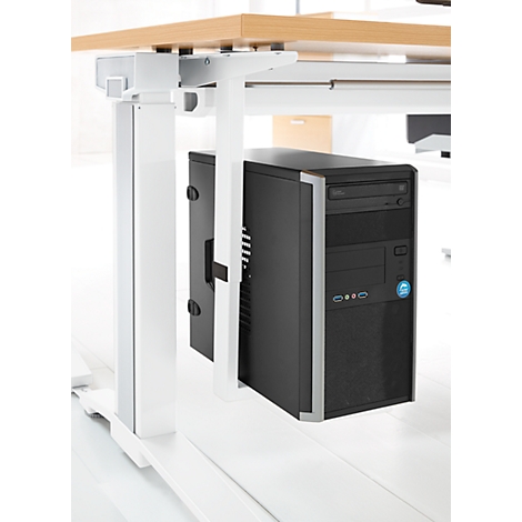 Un boîtier de PC monté sous un bureau.