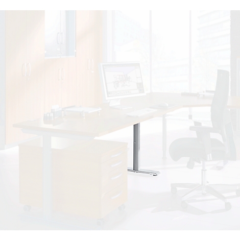 Height-adjustable desk with monitor. Office chair and window in background. Yellowish colors dominate.