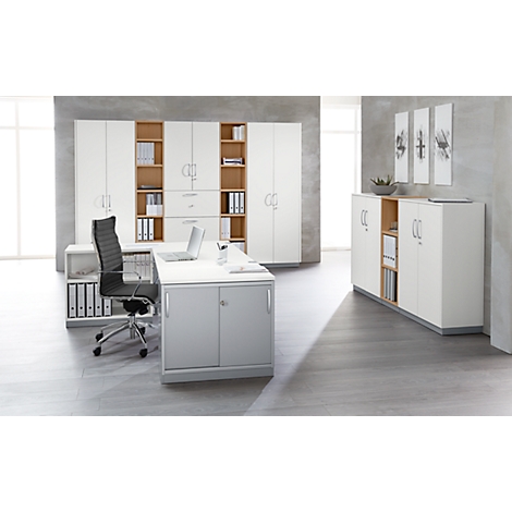 Office with white and gray furniture, desk, chairs, and cabinets. Art on the wall in the background.