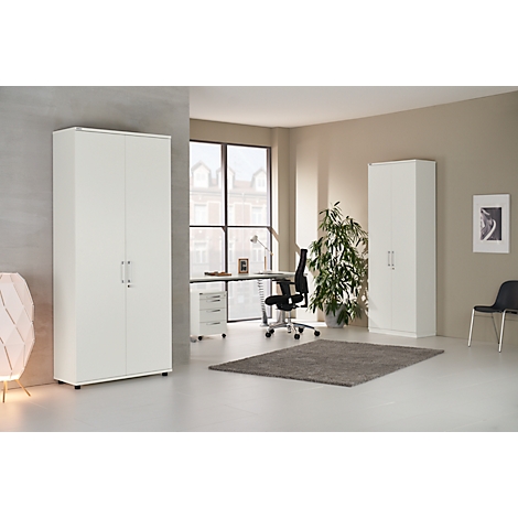 A bright office space featuring white cabinets, a desk, a chair, and a green rug.