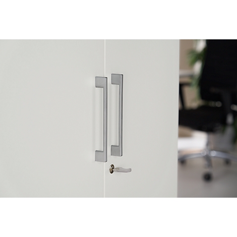 White cabinet door with two long, silver handles and a keyhole.