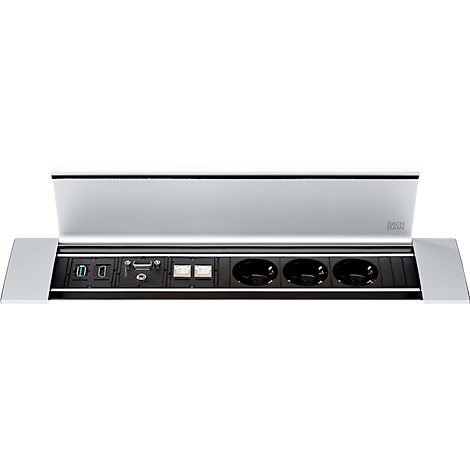 Zilveren tafelverbinding met stopcontacten, USB, HDMI en andere aansluitingen. De bovenklep is open.