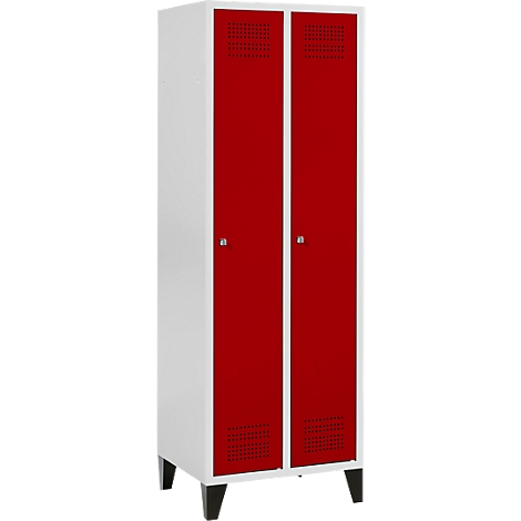 Une armoire blanche à deux portes rouges. Petits trous dans les portes. Pieds noirs.