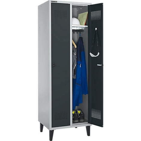 Gray and black locker with the door open. Inside are work clothes, shoes and a light-colored safety helmet.