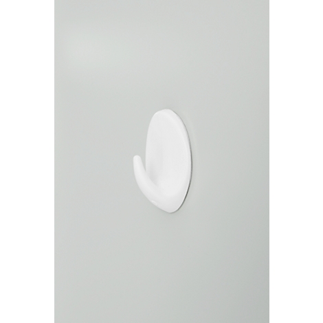 White hook with rounded shapes on a grey background. The hook stands slightly off the wall.